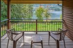 Private deck off primary bedroom with views of the lake.